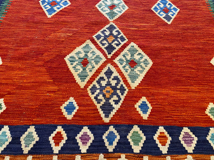 Handwoven Geometric Kilim Rug with Vibrant Tribal Patterns