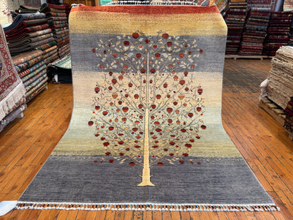 Decorative rug with a tree design on a wooden floor