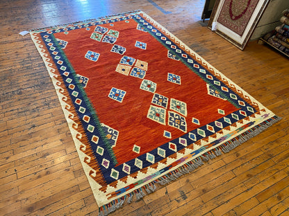 Decorative rug with geometric pattern on a wooden floor