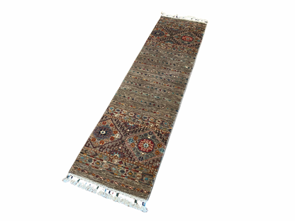 Decorative runner rug with intricate patterns on a white background